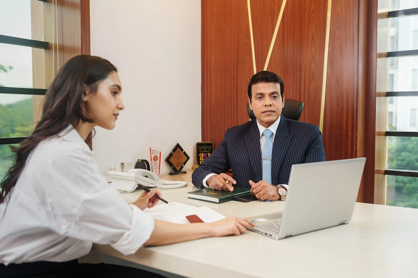 Financial advisor and client discussing investment plans in an office