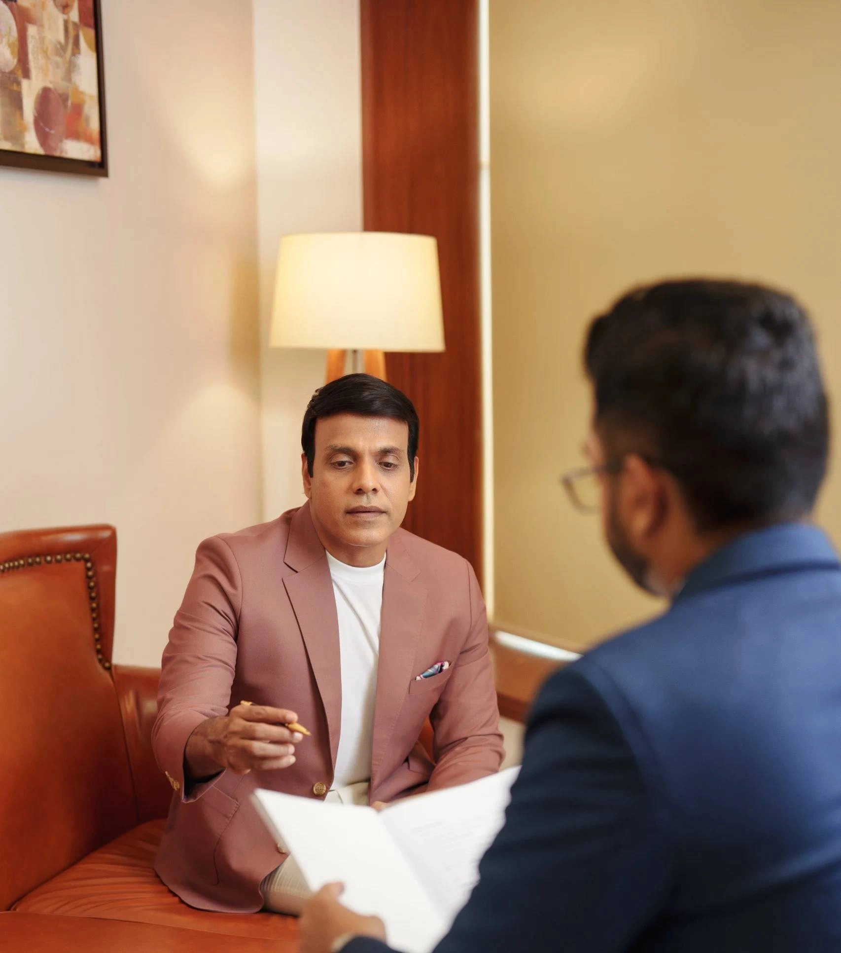 Financial advisor discussing investment strategies with a client in an office meeting