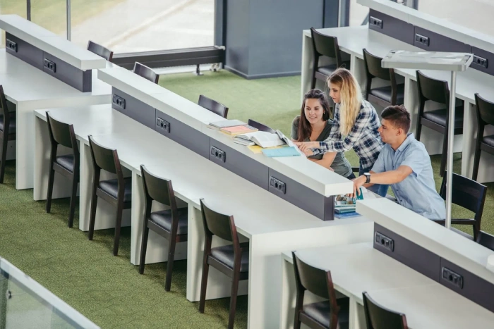 Students collaborating in an educational trust workspace